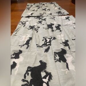 2 mint colored pillowcases with B&W horses